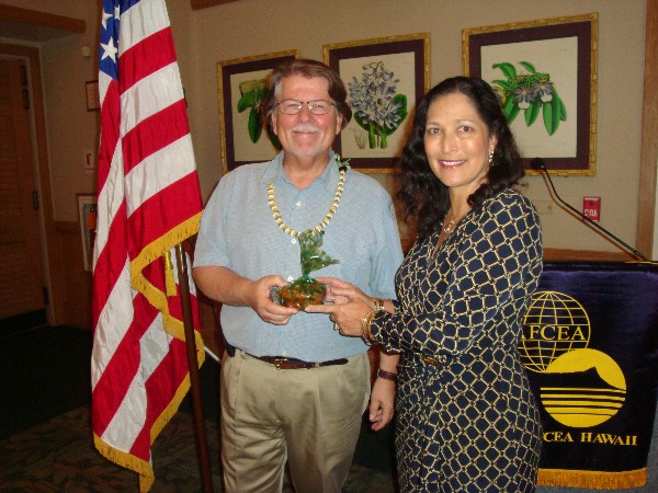 Cynthia Pacheco, chapter president, thanks the guest speaker for March, Peter Colvin, director of program development and outreach for the Maui High Performance Computing Center.
